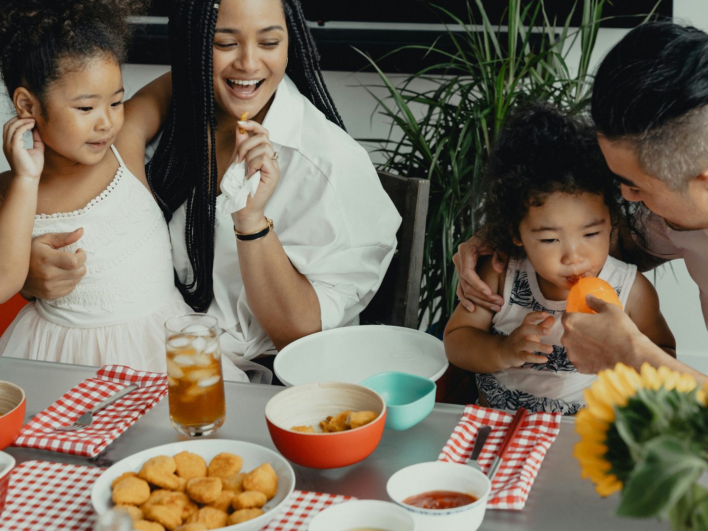 An Arizona family sharing a meal at home — joyful, real, the feeling of home